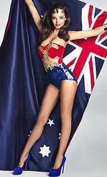 Miranda Kerr dressed as Wonder Woman, holding an Australian Flag